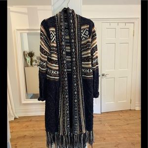 Gorgeous deep blue sweater with ivory blue and orange detail and fringe trim.